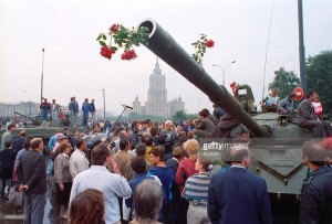 Russian citizens challenging the young and confused troops in the tanks by decorating these lethal weapons with flowers.